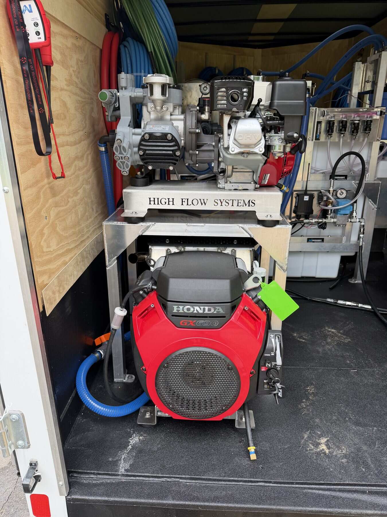 Pressure-wash and soft-wash pumps in the BolAero mobile equipment trailer