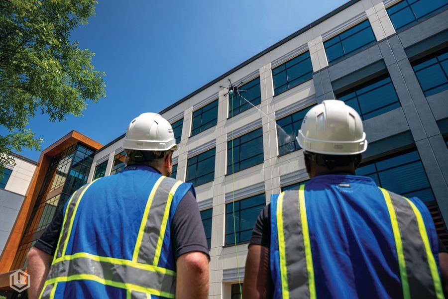 BolAero drone cleaning high-rise commercial building exterior in DFW — no scaffolding required